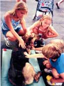 Photo of Kids Petting Dog